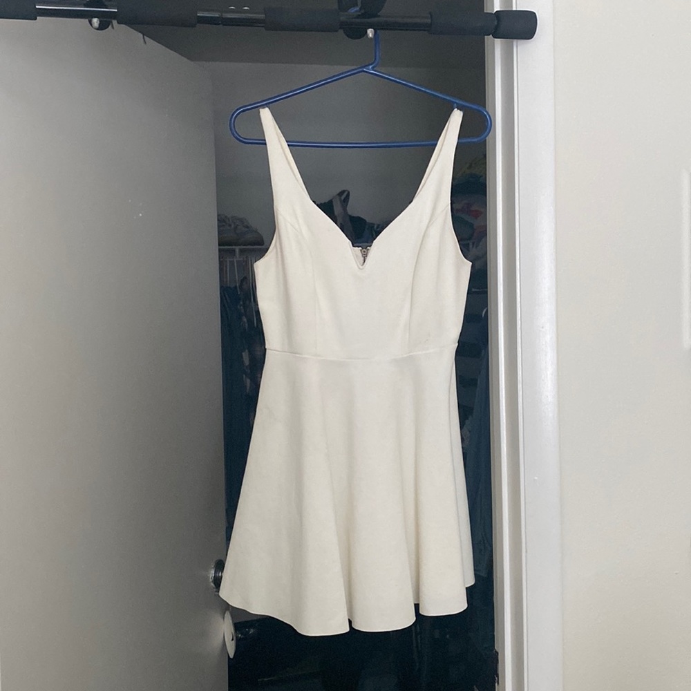 bought at Urban outfitters size medium white dress with heart detail on zipper